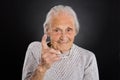 Smiling Elder Woman Waving Her Finger