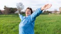 Smiling elderly caucasian woman in sports clothes, doing sports in the park. International Day of Older Persons. Concept Royalty Free Stock Photo