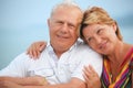 Smiling elderly couple on veranda near seacoast Royalty Free Stock Photo