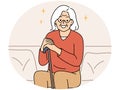 Smiling elderly grandmother sit on sofa