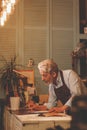 Smiling elderly man in uniform at work Royalty Free Stock Photo