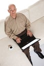 Smiling elderly senior man with laptop Royalty Free Stock Photo