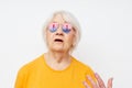 smiling elderly woman in fashionable glasses hand gestures close-up emotions Royalty Free Stock Photo