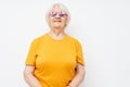 smiling elderly woman in fashionable glasses hand gestures close-up emotions Royalty Free Stock Photo