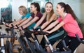 Smiling elderly and young women working out hard Royalty Free Stock Photo