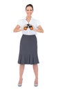 Smiling elegant businesswoman holding binoculars Royalty Free Stock Photo