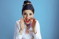 smiling elegant stewardess woman on blue shouting Royalty Free Stock Photo