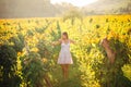 Smiling elegant woman in nature.Joy and happiness.Serene female in wine grape field in sunset.Wine growing field.Agricultural tour