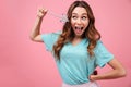 Smiling emotional young woman holding magically stick star