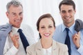 Smiling employee posing with her work team