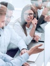 Smiling employees of call center talk sitting behind a Desk Royalty Free Stock Photo