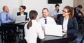 Smiling employees with laptops having a productive day Royalty Free Stock Photo