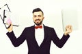 Smiling employer in classic black suit and red bow tie