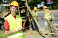 Smiling Engineer builder at road works site Royalty Free Stock Photo