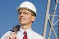 Smiling engineer on construction site Royalty Free Stock Photo