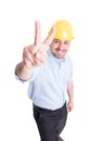 Smiling engineer showing peace sign or number two Royalty Free Stock Photo