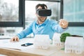 Smiling engineer using VR headset while designing construction