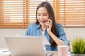 Smiling, entrepreneur asian young professional business woman discussing on call mobile, using device laptop computer on desk, Royalty Free Stock Photo