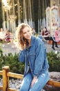 Smiling excited girl having fun at amusement park at hot summer day Royalty Free Stock Photo