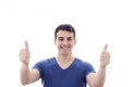 Smiling excited young man with thumb up Royalty Free Stock Photo