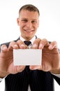 Smiling executive holding business card