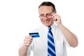 Smiling executive holding credit card Royalty Free Stock Photo