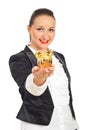 Smiling executive with piggy bank in her hand