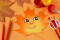 Smiling face hand-painted on dry maple leaf Royalty Free Stock Photo