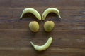 A smiling face made out of various fruits