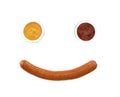 Smiling face from mustard with ketchup and sousage