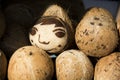 A smiling face sculpted in Coconut, Dali, Yunnan, China.