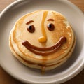 Smiling face, smiley face on a fresh delicious pancake, cheerful dessert, joy,