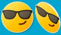 Smiling face with sunglasses emoji - emoticon with smiling face wearing dark sunglasses that is used to denote a sense of cool Royalty Free Stock Photo