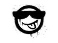 Smiling face and Tongue out emoticon character with sunglasses. Spray painted graffiti smile face in black over white Royalty Free Stock Photo