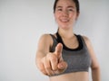 Young Asian woman in sport bra pointing finger on isolated . Royalty Free Stock Photo