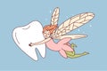 Smiling fairy flying with tooth