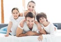 Smiling family in bed Royalty Free Stock Photo