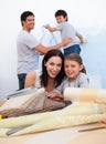 Smiling family doing up their new home Royalty Free Stock Photo