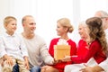 Smiling family with gift at home Royalty Free Stock Photo