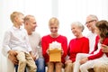 Smiling family with gift at home Royalty Free Stock Photo