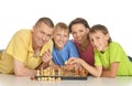 Smiling family playing chess together Royalty Free Stock Photo