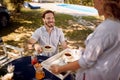 Family relaxing on picnic in nature.Man and woman enjoying together outdoor