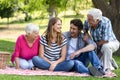 Smiling family sitting on a blanket Royalty Free Stock Photo