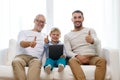 Smiling family with tablet pc at home Royalty Free Stock Photo