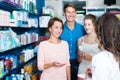 Smiling family of three consulting druggist Royalty Free Stock Photo