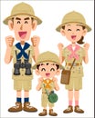 A smiling family of three in expedition clothes