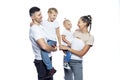 Smiling family with two small children. Mom, dad and little son and daughter. Children in the arms of their parents. Love and Royalty Free Stock Photo