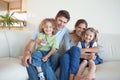 Smiling family watching TV together Royalty Free Stock Photo