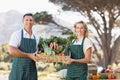 Smiling farmer couple holding a vegetable basket Royalty Free Stock Photo