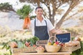 Smiling farmer holding a bunch of carrots Royalty Free Stock Photo